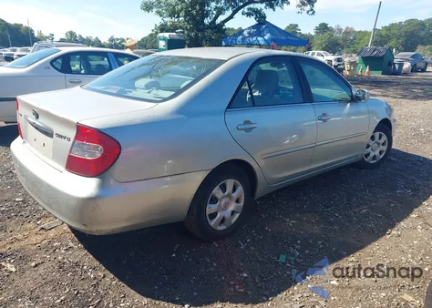 2003 Toyota Camry Le z USA, uszkodzony, nr VIN 4T1BE32K13U123714